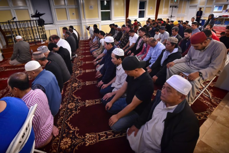 Brothers in Tashahhud position in prayer in Men's area in ICSA