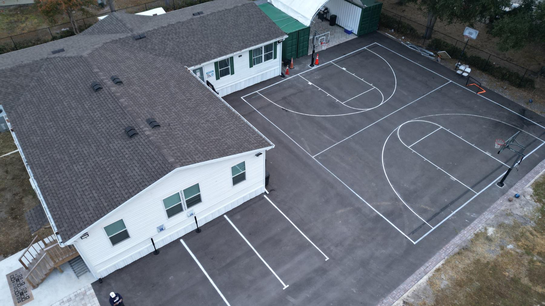 Aerial view of the current Masjid Al Huda building and basketball court