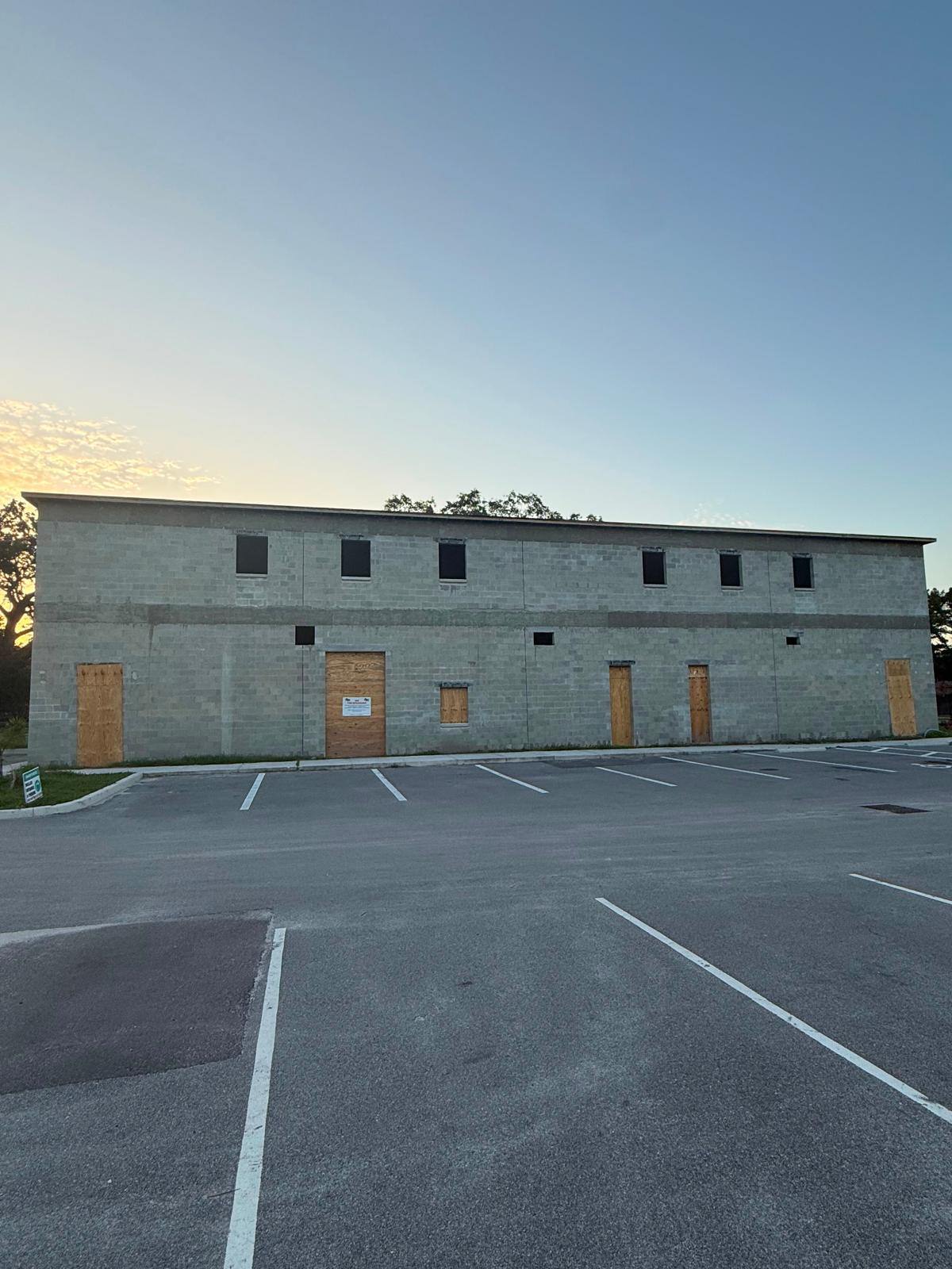 The new masjid at sunset with the concrete block shell and roof completed